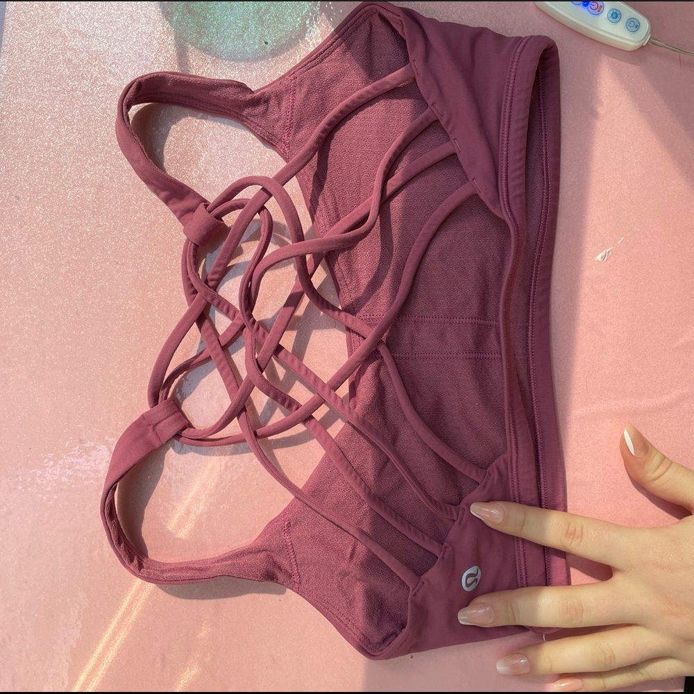 Lululemon worn sports bra with cross body back plum color